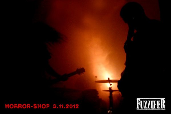 Fuzzifer in dark horror shop.jpg