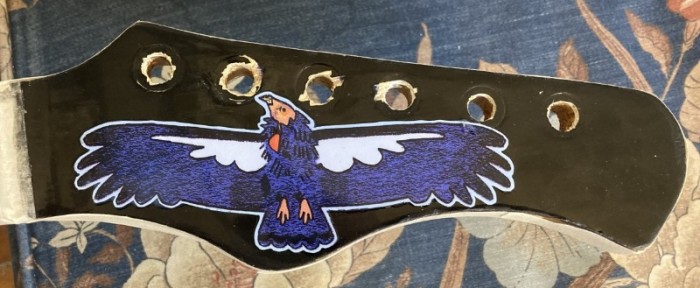 headstock w coat on sticker.jpg