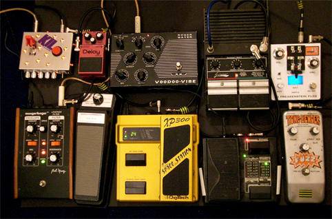 Boss CS2 compressor (not in shot) > Colorsound Tonebender > Rainger FX Dr Freakenstein Fuzz > Digitech Whammy II > Maniac Music Sustainiac > Digitech Space Station > Roger Mayer Voodoo Vibe > Moogerfooger lo-pass filter (with cut-off pedal) > Boss DM2 delay > KIL Switch...